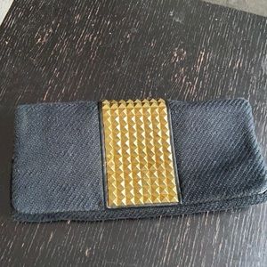 Black and gold studded clutch